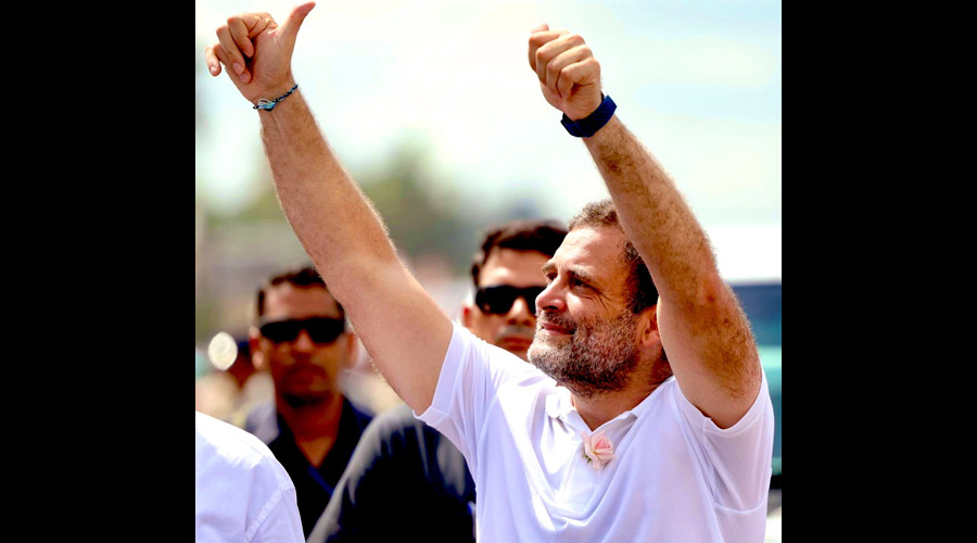 Congress leader Rahul Gandhi gestures at crowd during his Bharat Jodo Yatra in Kerala.