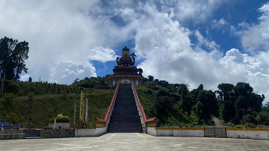 Once you are done exploring the Pemayangtse Monastery grounds, head over to the next stop — the Chenrezig statue and skywalk. If the gorgeous views from the last location made you swoon, this spot will make your jaw drop! Awaiting visitors is a mesmerising 137-feet-tall Bodhisattva Chenrezig statue. The grand structure, sitting on top of a hillock, juxtaposed against the clear blue skies of Sikkim, is bound to make an impression on you. (Entry is ticketed)