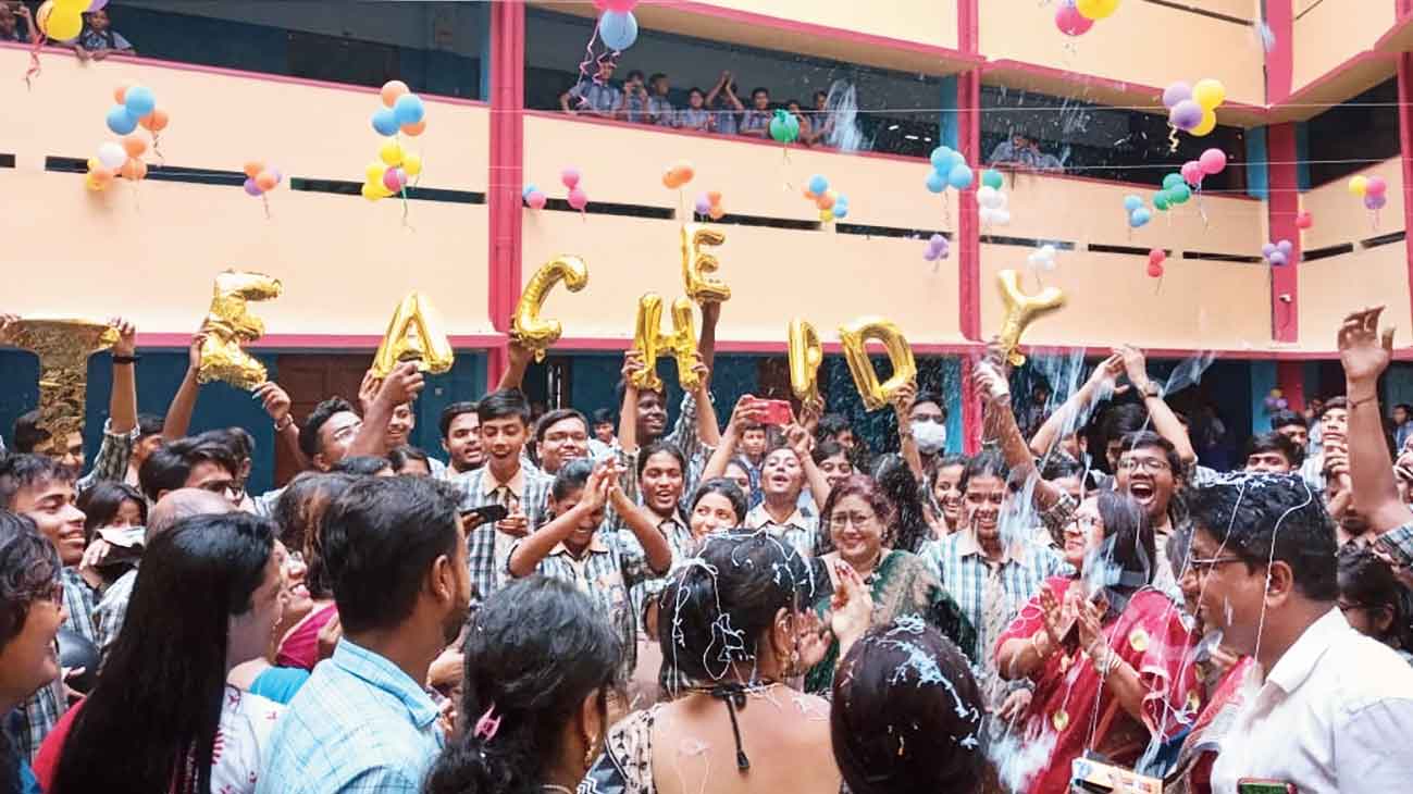 The letters of the words Teachers Day being held aloft in the courtyard of Bidhannagar Municipal School in FE Block. 
