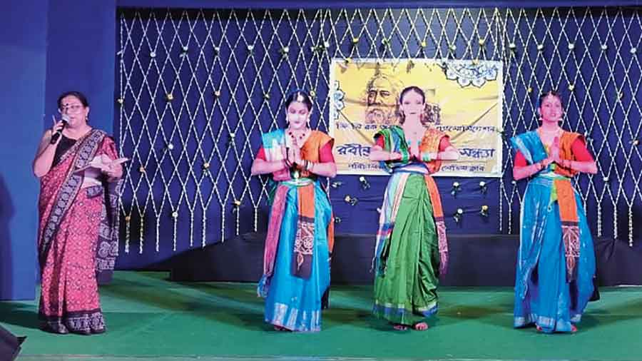 Dancers greet the audience before their performance at GC community hall 