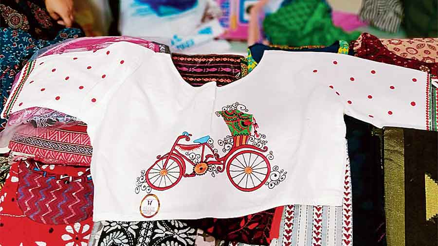 White and red blouse with embroidery is a big hit this season