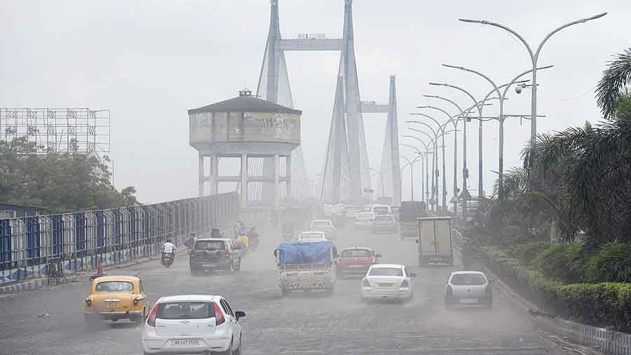 A haze of dust over the city-bound flank of Vidyasagar Setu on Friday morning. 