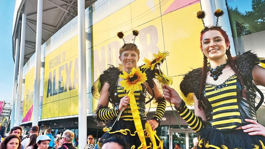 Two young women on stilts formed  the welcoming party at Alexander Stadium, while pulsating bhangra held sway inside