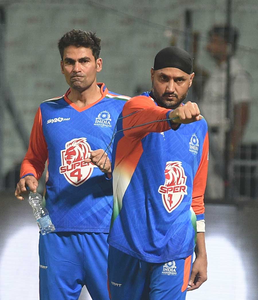 Mohammad Kaif helps Harbhajan Singh of India Maharajas warm up before a match between India Maharajas and World Giants at the Eden Gardens in Kolkata, Friday, September 16. The Legends League Cricket 2022 is a T20 tournament for retired legendary players