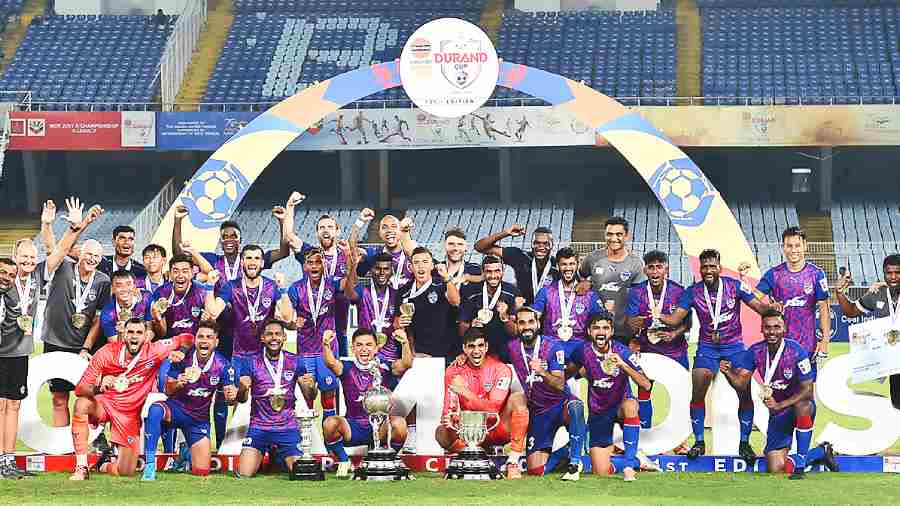 Jubilant Bengaluru FC players and support staff after winning the Durand Cup on Sunday.