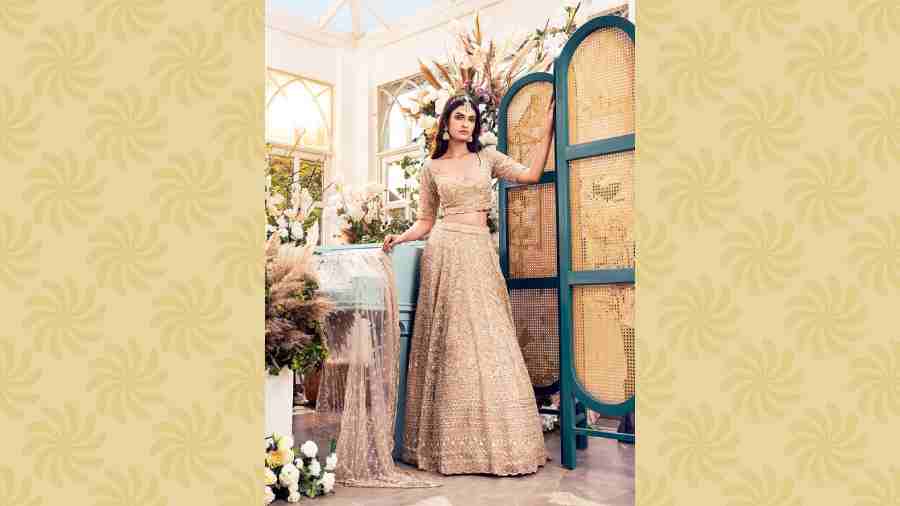 Margaret lehnga: This golden organza lehnga with heavy zardozi work has cutdana and sequin work in floral patterns. It has an elaborate border, a plunging neckline and a sheer back. A matching net dupatta with heavy embroidery completes the attire. Price: Rs 1,44,000