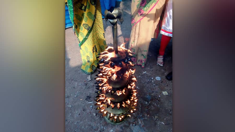 One of the diya stands is placed on the  vacant stage after the immersion of the idol