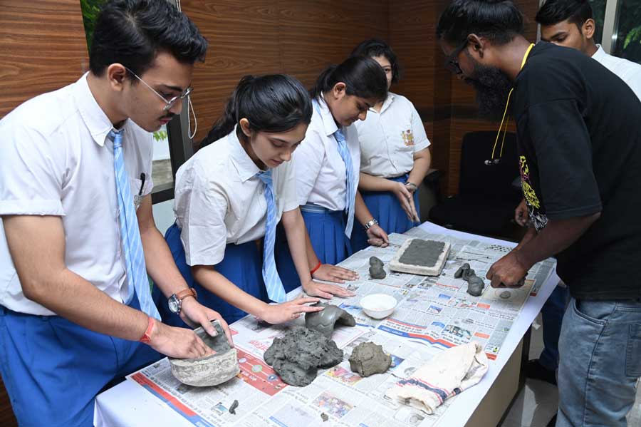 Schoolchildren learn how to make eco-friendly Durga idols at a workshop at Victoria Memorial on Wednesday.
