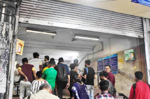 Commuters enter Esplanade Metro station on Tuesday evening. 