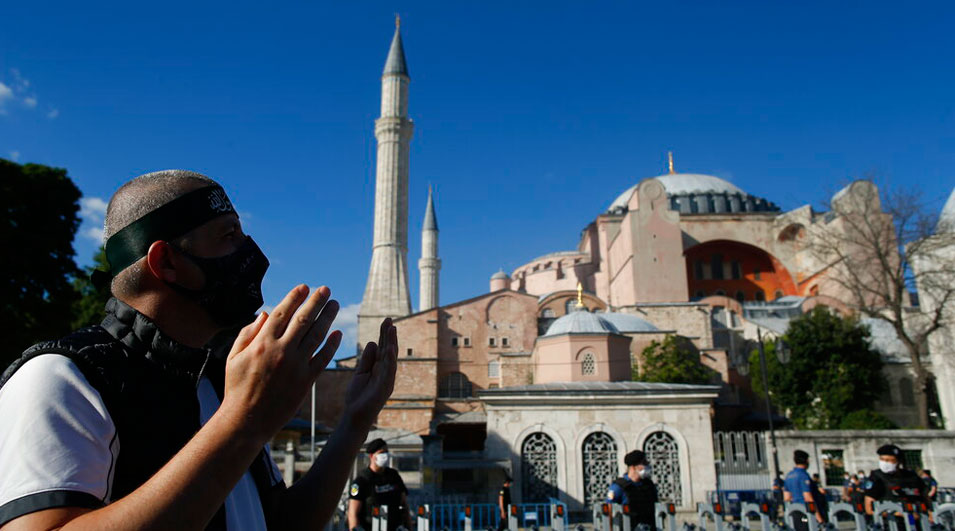An Istanbul resident prays outside the Hagia Sophia on Friday.