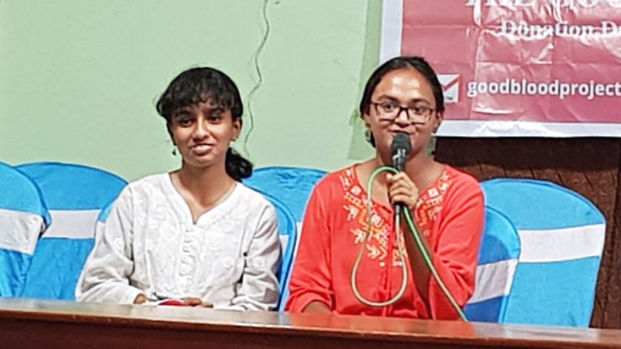 Asmita Bhattasali and (right) Prisha Bhattacharjee address girls at Champa Mahila Samity in Basanti