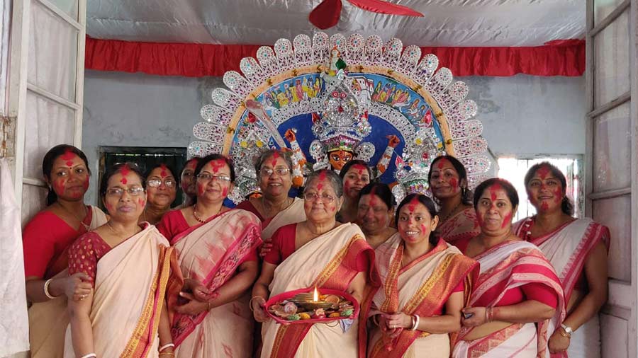 The women of the Dasgupta family gather for a group photo session after the baran
