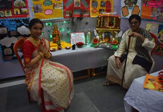Students showcasing the festivity of Durga Puja which is celebrated in the city with grandeur