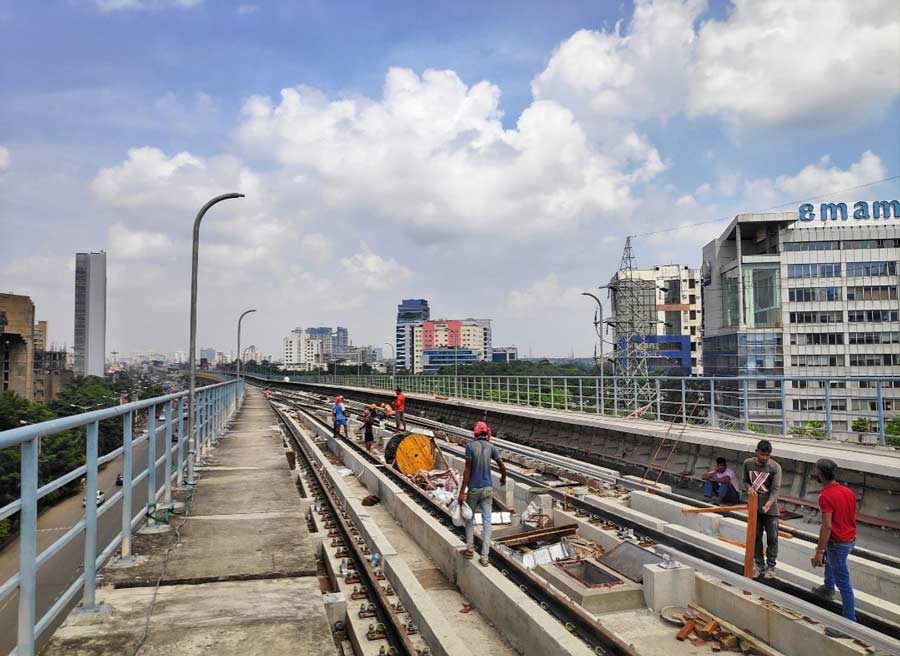 Workers putting finishing touches to the New Garia-Ruby Metro section on Friday. Metro Railway general manager, Arun Arora, had earlier announced that the truncated stretch would be commissioned in November, 2022. A joint inspection was also carried out by Metro Railway and Rail Vikas Nigam Ltd. 