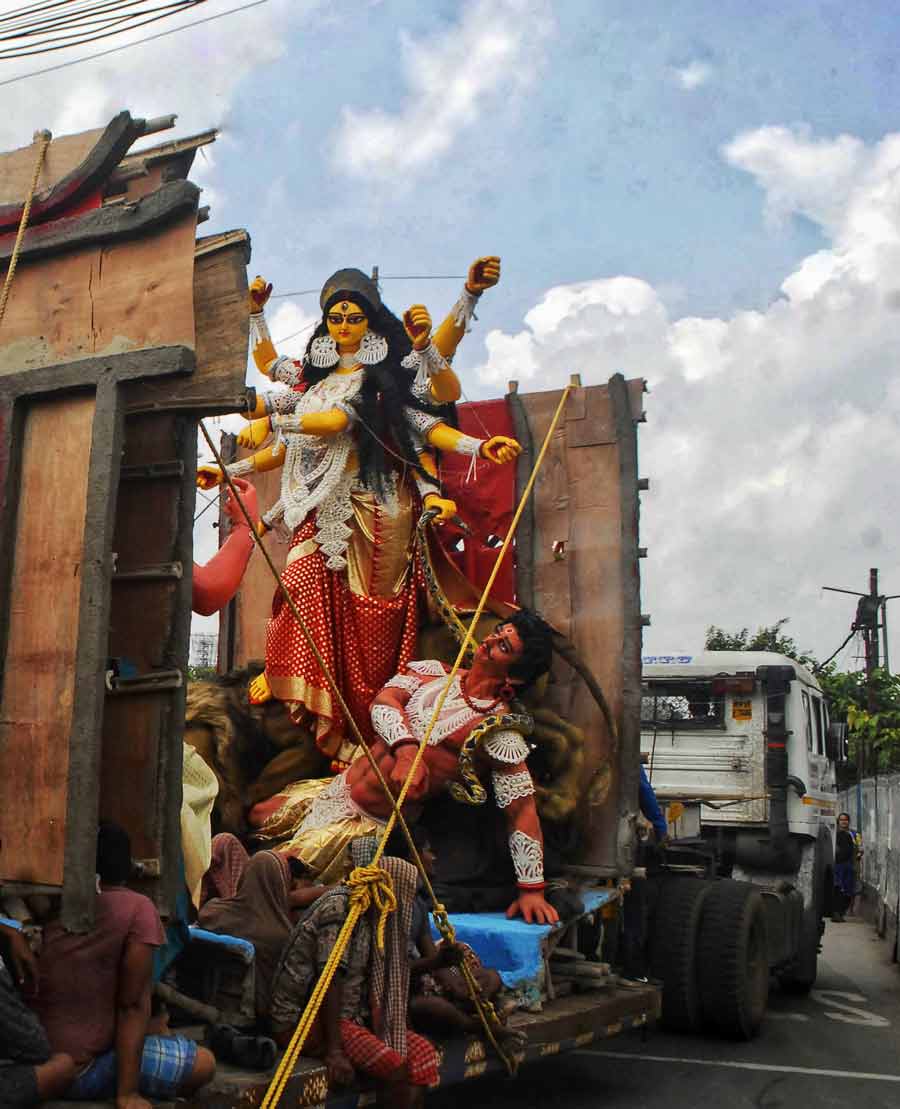 A Durga idol being ferried out of Kumartuli on a truck on Friday.
