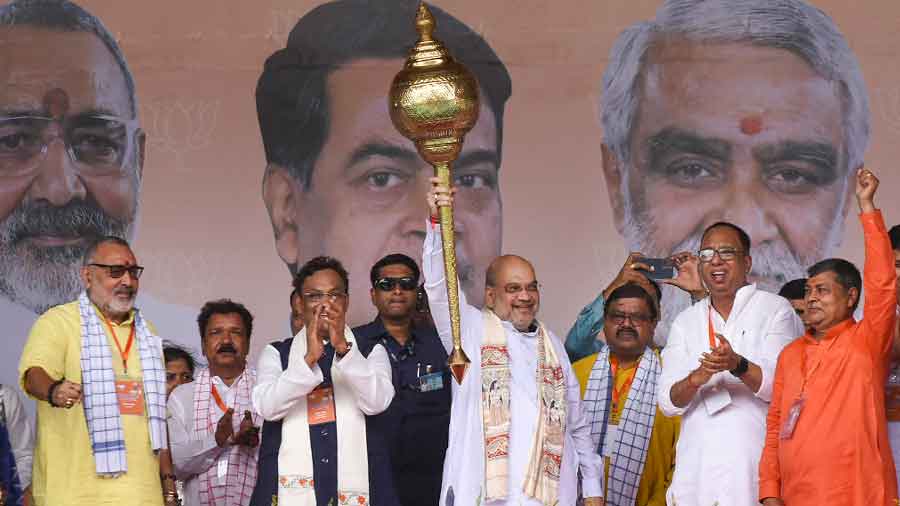 Union Home Minister Amit Shah holds a mace during BJPs Jan Bhavna rally in Purnea, Bihar