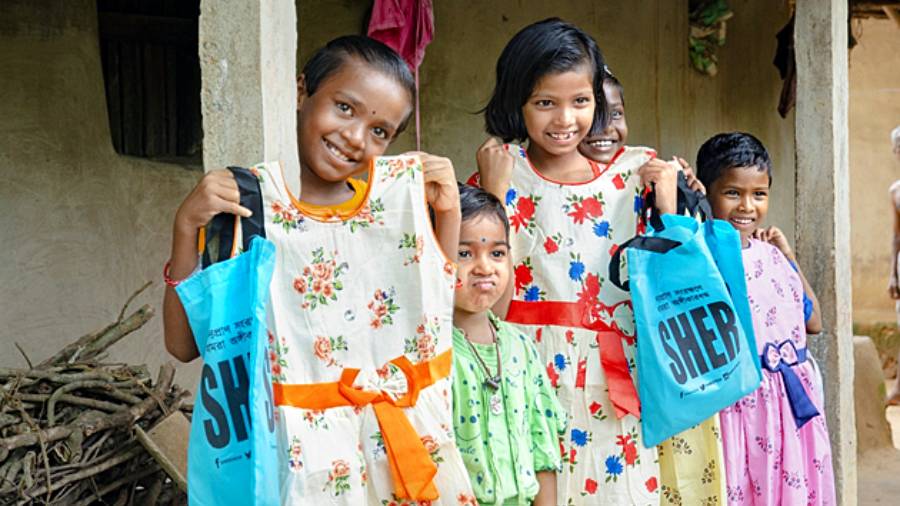 Children with new clothes at Pirakata in Paschim Medinipur