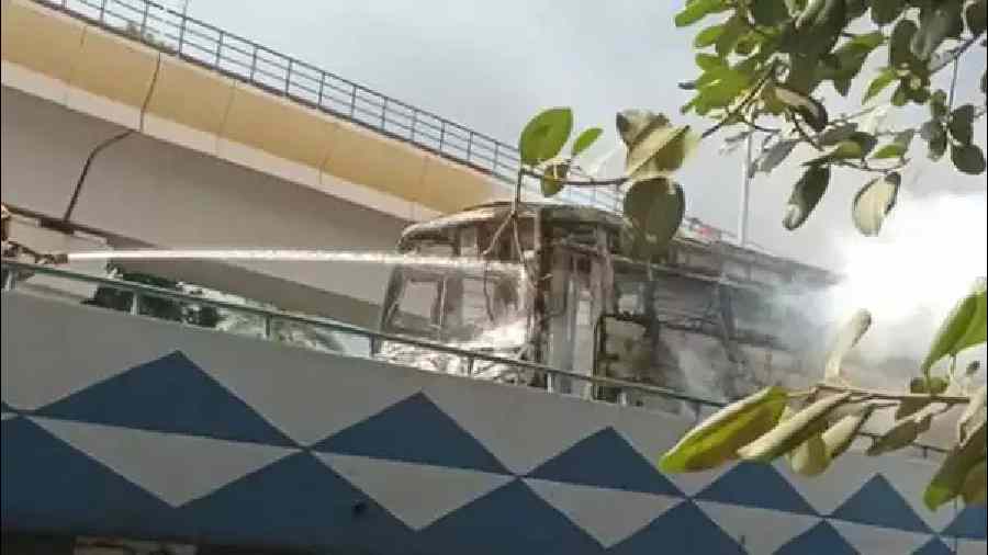 Empty school bus caught fire near the Taratala Flyover in the south-western part of the city on Monday
