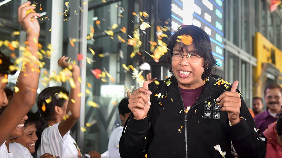 Fans shower cricketer Jhulan Goswami with flower petals at Kolkata airport on her return from Engliand on Monday. The 39-year-old Goswami ended her illustrious career as India Women beat England by 16 runs in the third and final ODI at the Lord's to record their first clean sweep on English soil. One of the greatest fast bowlers to have ever played the game, Goswami left the scene as women cricket's highest wicket-taker, having started her journey way back in 2002. She finished with 44 wickets in 12 Tests, 255 wickets in 204 ODIs and 56 wickets in 68 T20Is.