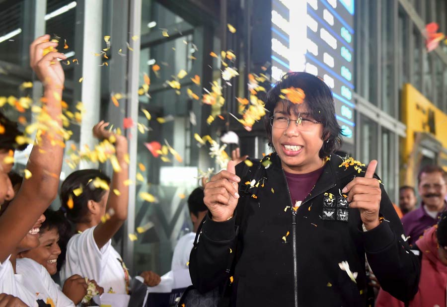 Fans shower cricketer Jhulan Goswami with flower petals at Kolkata airport on her return from England on Monday. The 39-year-old Goswami ended her illustrious career as India Women beat England by 16 runs in the third and final ODI at the Lord's to record their first clean sweep on English soil. One of the greatest fast bowlers to have ever played the game, Goswami left the scene as women cricket's highest wicket-taker, having started her journey way back in 2002. She finished with 44 wickets in 12 Tests, 255 wickets in 204 ODIs and 56 wickets in 68 T20Is.