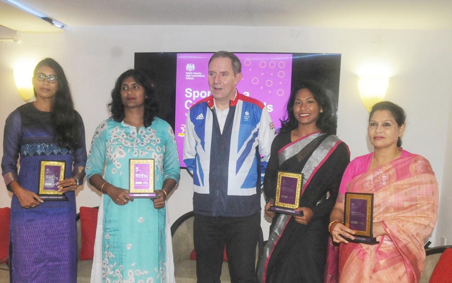(Centre) British deputy high commissioner Nick Low flanked by (from left) athletes Susmita Singha Roy, Soma Biswas, Swapna Burman and swimmer Bula Choudhury at an event celebrating International Girl Child Day at British Deputy High Commission Kolkata on Monday. 