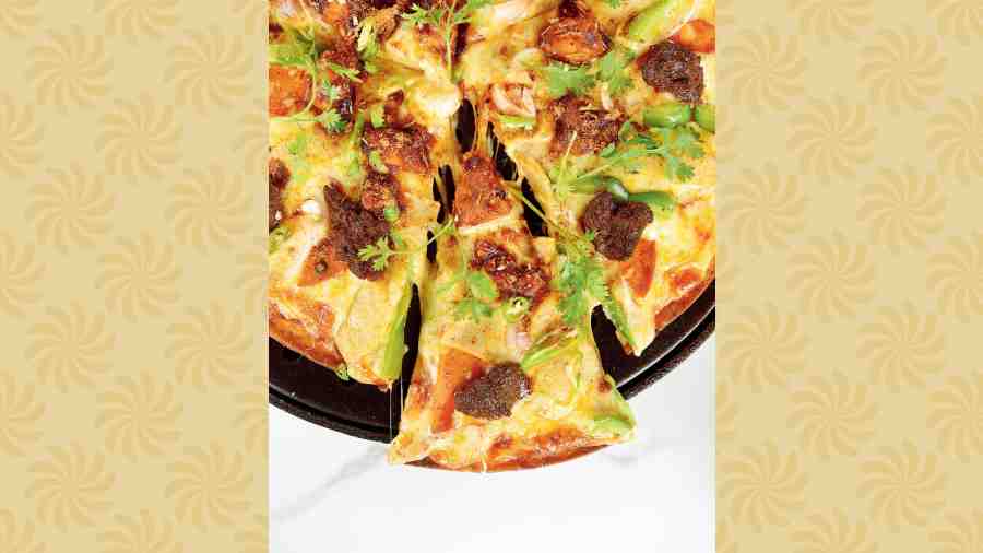 Meat Lover’s Pizza: This has chicken chunks, salami, as well as cooked mutton chunks and is a loaded hot and sweet pizza that will be a hit with the Indian palate for sure.