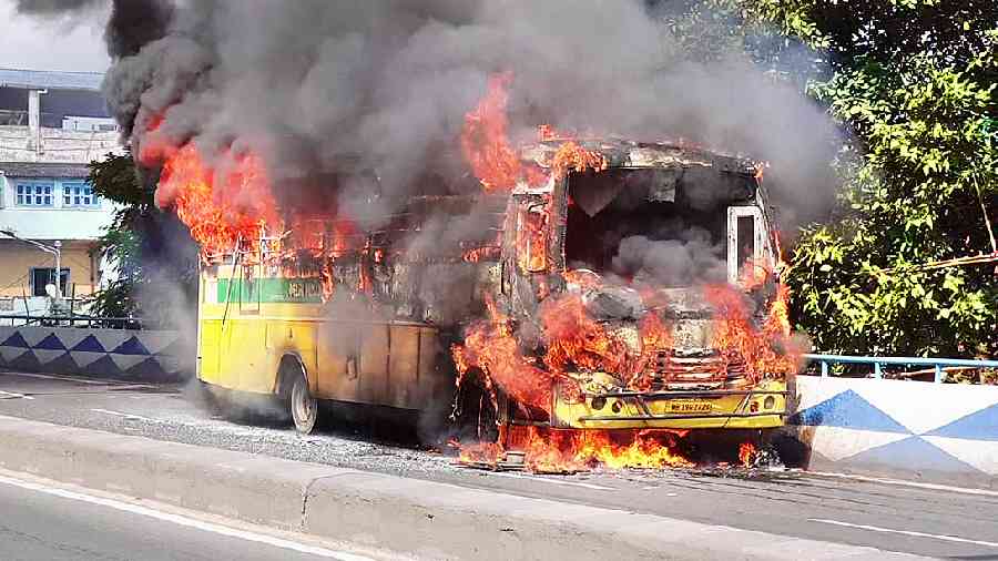 The school bus in flames on the Taratala flyover on Monday afternoon