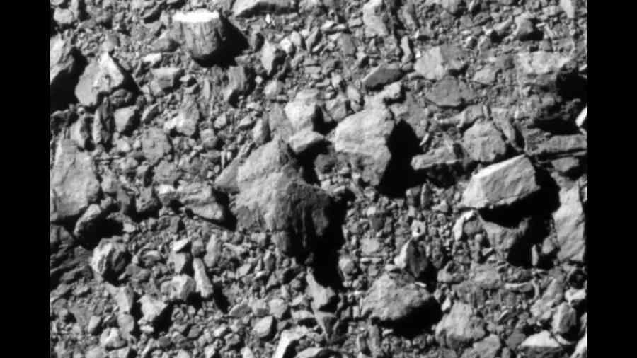 The final image from DART, taken at a distance of 12 km and 2 seconds before impact. The image shows part of the asteroid Dimorphos about 31 metre across