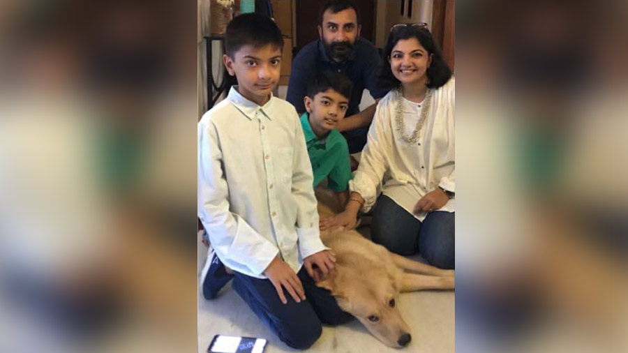 The Sanghvi family with their 11-month-old Golden Retriever