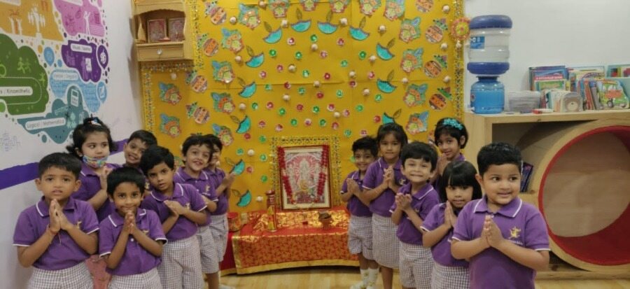Students of Kangaroo Kids International Preschool in Alipore celebrate Durga Puja with colourful artwork.