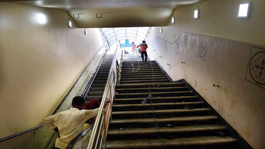 Workers give final touches before its inauguration on Friday.