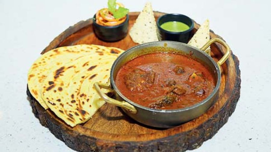 Jamaican Curry Goat with Shut Roti: If you are looking to try something different this festive season, try this staple Jamaican goat curry that looks like kosha mangsho but has heady dose of more Caribbean spices. Relish this with flaky parathas.