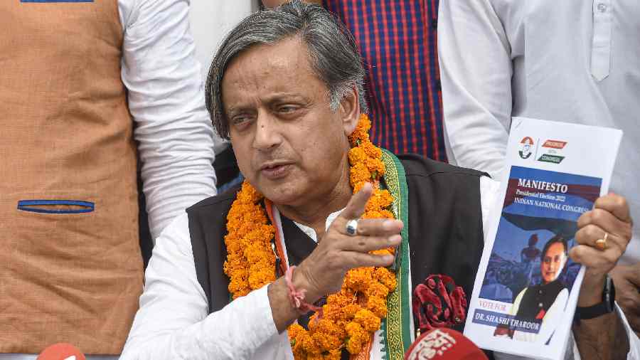 Shashi Tharoor addresses a press conference after filing his nomination papers for the post of party President in New Delhi on Friday