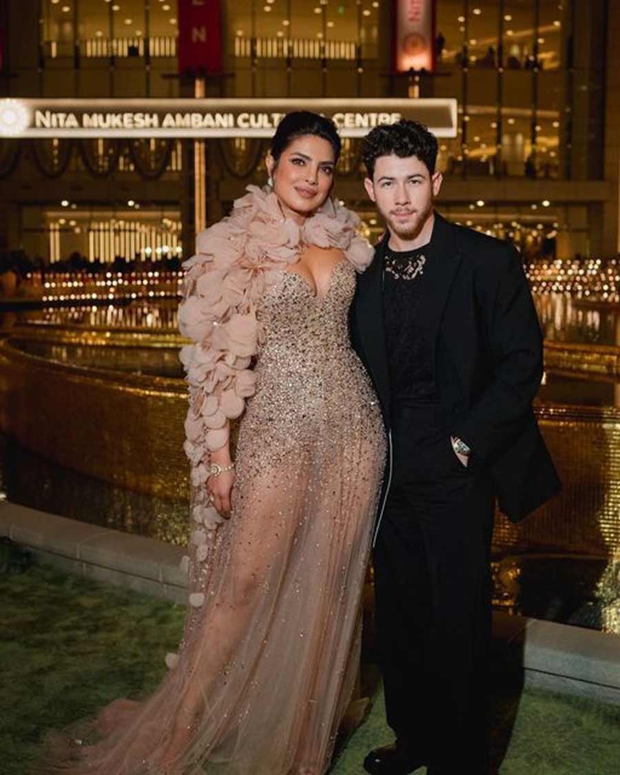 Priyanka Chopra turned heads in a blush pink sheer gown with a ruffled collar and silver embellishments all over it. Nick Jonas opted for a black lace top with a black suit. 