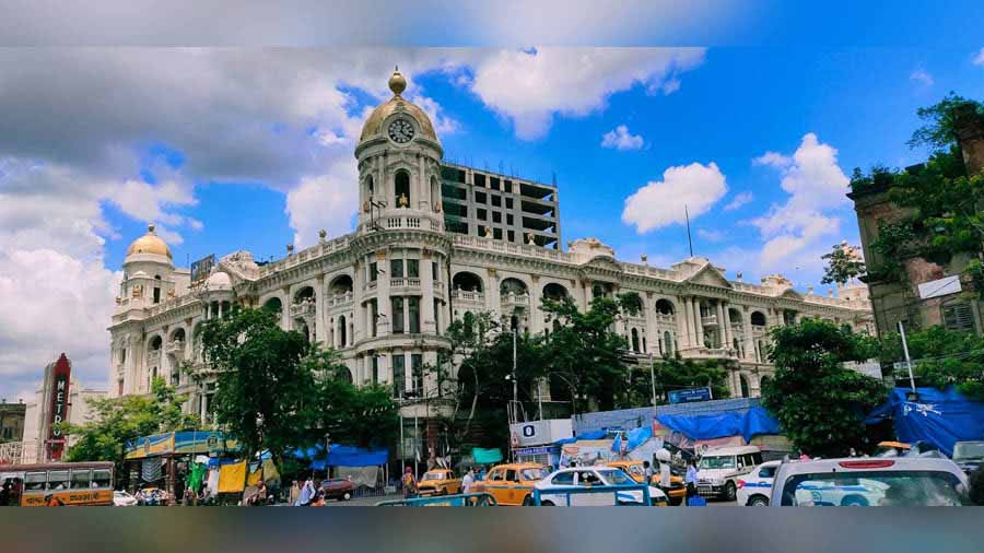 Swapan and Satyajit Dutta help maintain the clock beneath Metropolitan Building’s bright golden dome on Chowringhee 