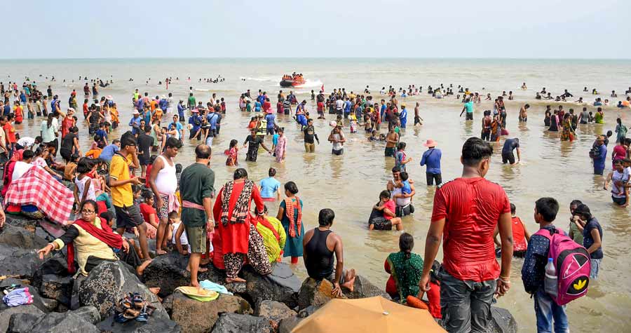 Tourists crowd a Digha beach, in East Midnapore district, on Monday  