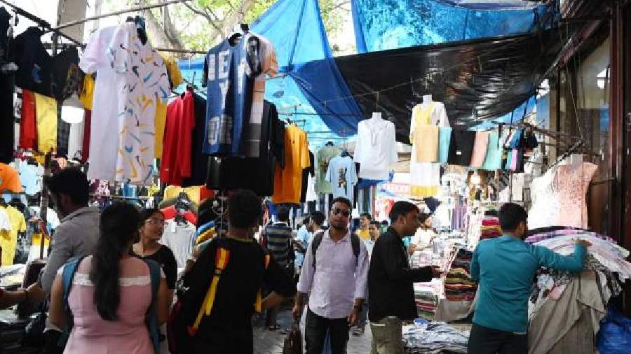 Plastic sheets over hawkers’ stalls in New Market on Sunday