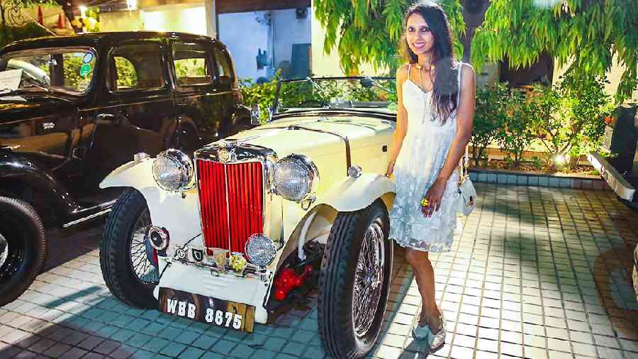 Preeyam Budhia dropped by to feast her eyes on the hot wheels. She posed with the 1947 MG TC which is owned by Himanshu Ajmera.