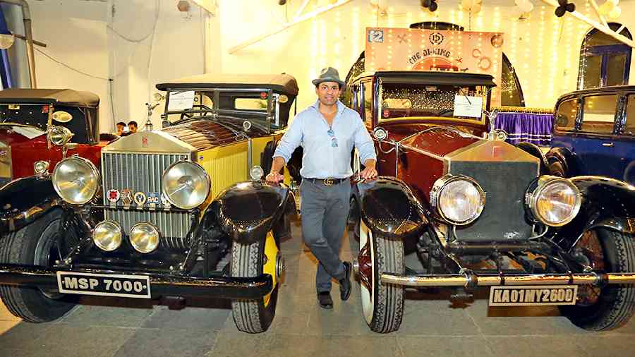 Shrivardhan Kanoria, EIMG founding president and an eminent vintage car collector/restorer, poses with two of his three Rolls-Royces displayed at the venue. On the right is a 1925 Rolls-Royce Phantom I and on the left is a 1926 Rolls-Royce Silver Ghost.