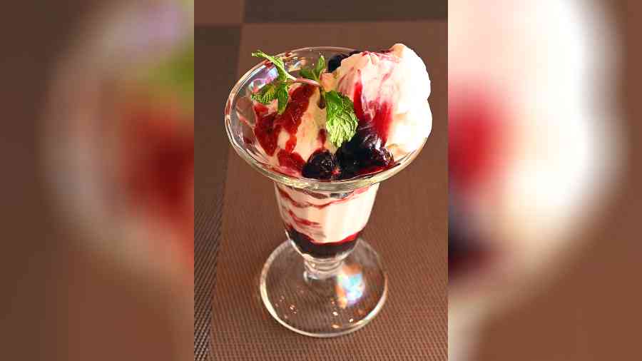 Berry Love Sundae: Fresh and thick berry compote with hearty scoops of creamy vanilla ice cream make this dessert a must-have. The tangy berry compote complements the mildsweetness of the ice cream to prevent an overwhelming taste. Rs 215