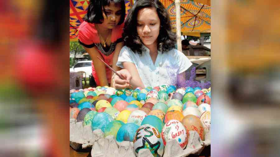 A girl decorating Easter eggs
