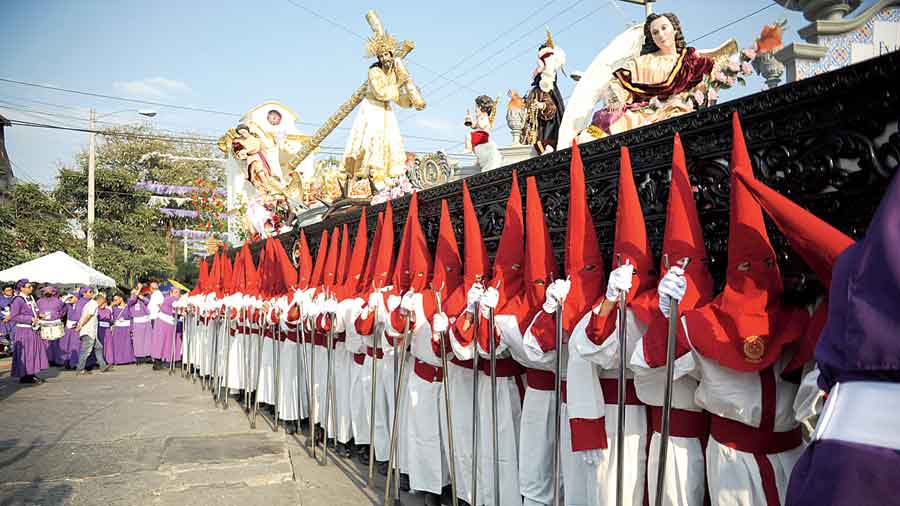 Members of the Beatas de Belen brotherhood participate in a procession during Holy Week in Guatemala City, Guatemala on Tuesday. 