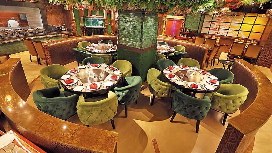 The new-look central seating area at Orko’s with faux foliage as decor.