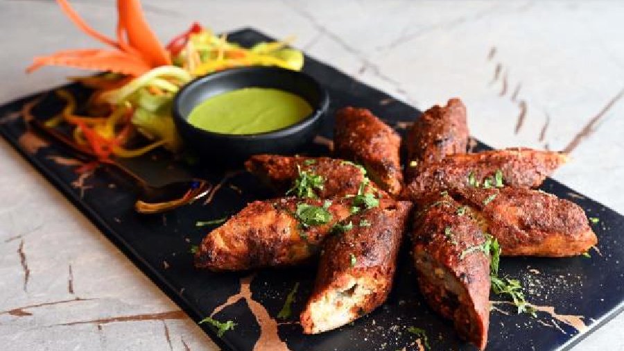 Noorani Seekh Kebab: A speciality at Pub 97, this dish has both chicken and mutton. First the chicken is put in seekh and half cooked and then mutton is put on top of it and cooked in tandoor again. The result? Yummy spicy mutton and tender chicken seekh kebabs.
