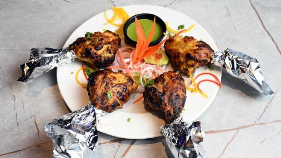 Nizami Tangri: Chicken Tangris are slit open and stuffed with chicken keema, nuts and Indian herbs and cooked in tandoor. Super delicious and filling, a portion has four pieces.