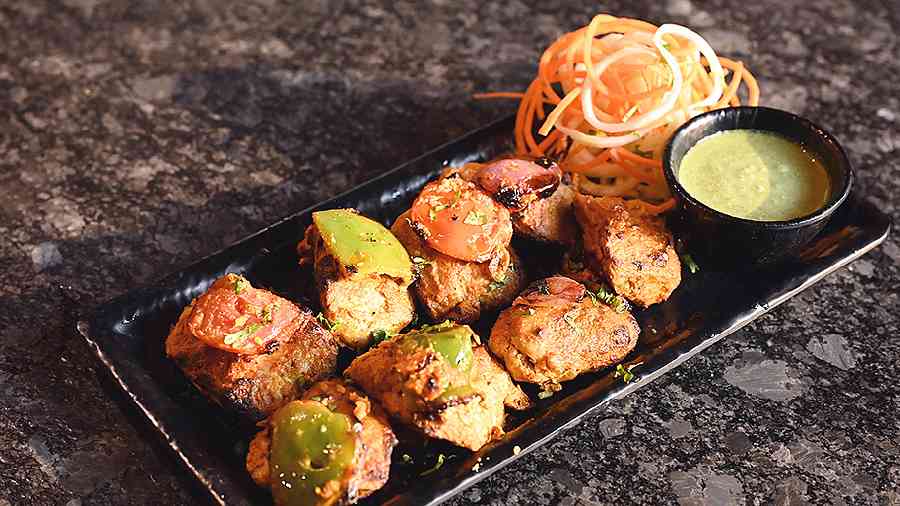 Try the protein-filled Soya Tikka, which is soft and marinated with Indian spices and hung curd and grilled with capsicum. Served with mint chutney and pickled onions.