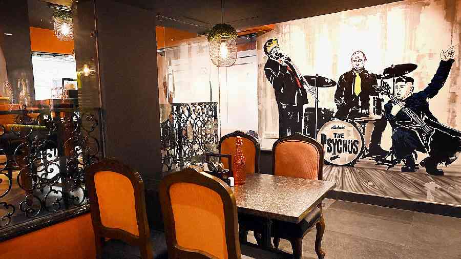 The interiors are a mixed bag of traditional and modern pop art. The glass-enclosed area is the hookah and dining zone.