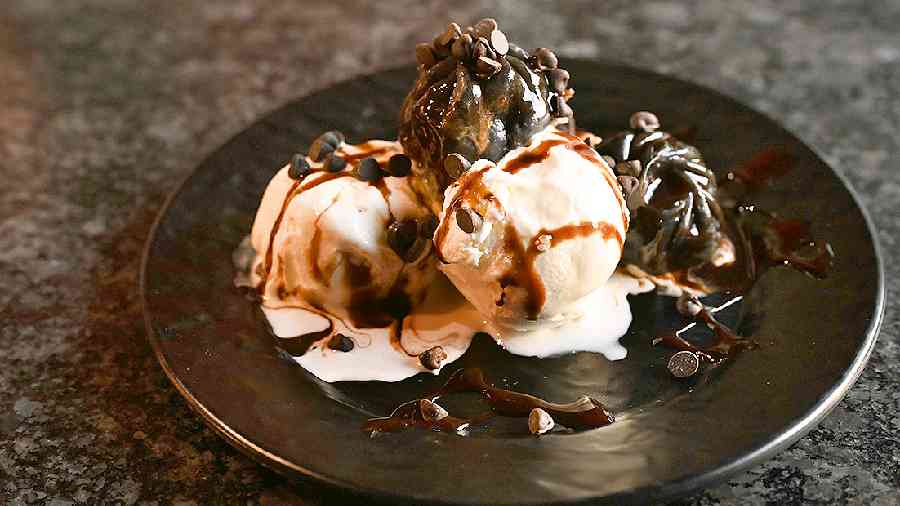 Chocolate Bomb for the chocolate lovers where you can dig into the warm chocolate momos with oozing chocolate sauce served with vanilla ice cream and an overload of chocolate chips.