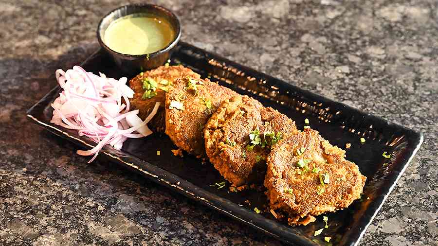 Authentic old Delhi cuisine is incomplete without Mutton Galouti Kebab, with soft, smoky minced meat marinated with special spices and pan-cooked with ghee