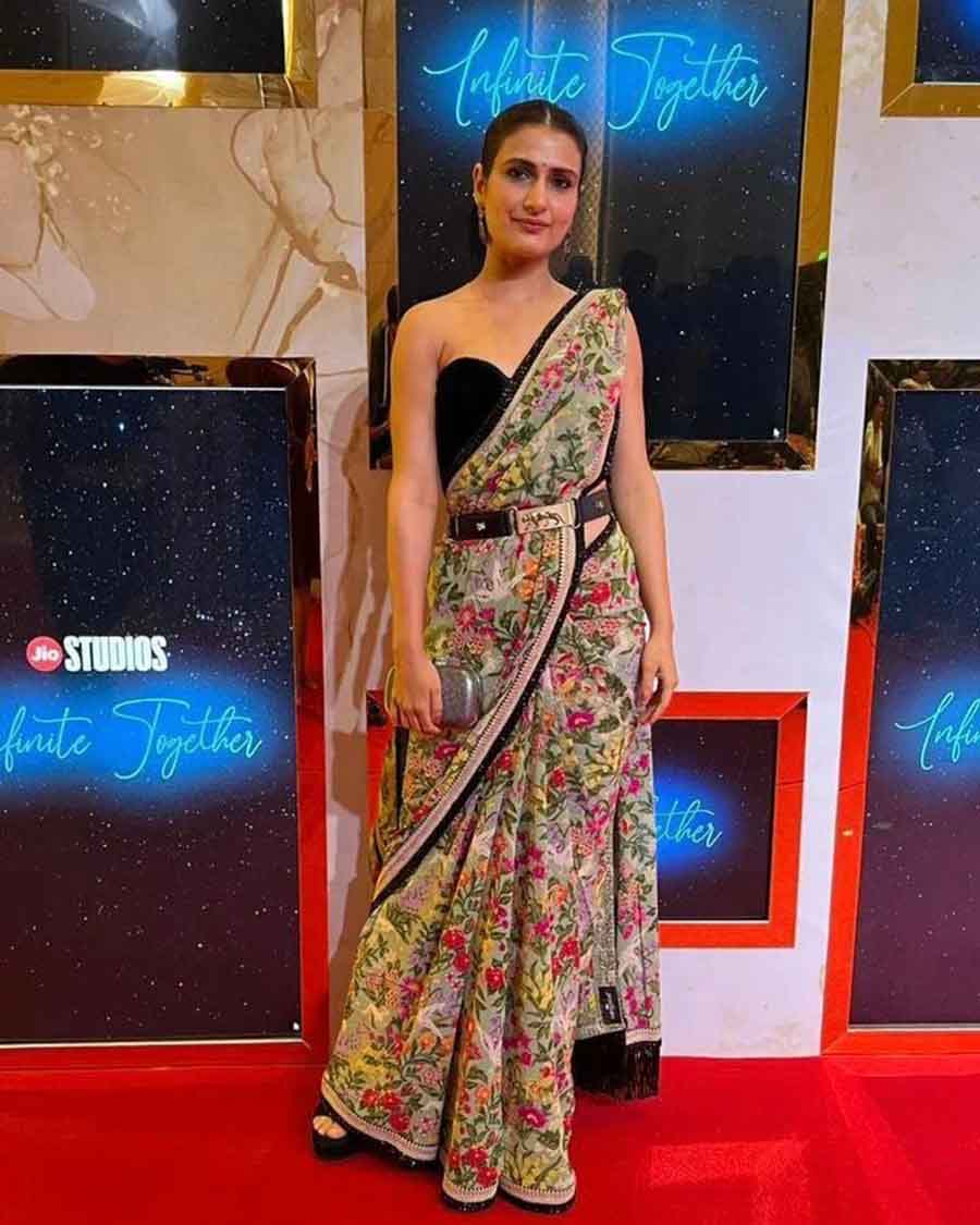 Fatima Sana Shaikh struck a pose in a floral sari paired with a black bralette and a Sabyasachi belt. 